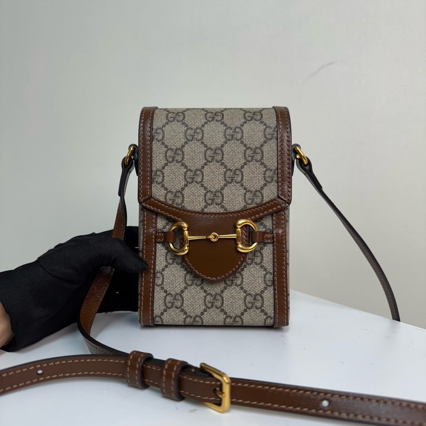 Gucci Horsebit 1955 phone holder in beige and ebony GG Supreme canvas 625615 92TCG 8563